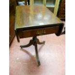 A REGENCY MAHOGANY TWIN FLAP PEDESTAL SIDE TABLE with single end drawer and opposing dummy front, on