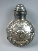 A SILVER SMELLING SALTS BOTTLE HOLDER, the circular case with embossed Reynolds angelic type