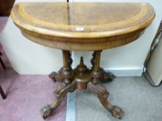A VICTORIAN BURR WALNUT FOLDOVER CARD TABLE, the semi-circular top with inlaid band opening to