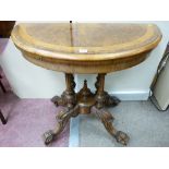 A VICTORIAN BURR WALNUT FOLDOVER CARD TABLE, the semi-circular top with inlaid band opening to