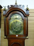 A CIRCA 1820 BRASS DIAL LONGCASE CLOCK, the 12 ins arched top dial set with Roman numerals,