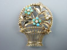 A NINE CARAT GOLD BROOCH in the form of a flower basket, the flowers decorated with aquamarines