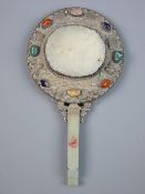 A CHINESE SILVER & JADE CIRCULAR HAND MIRROR with celadon jade belt hook handle having a bat