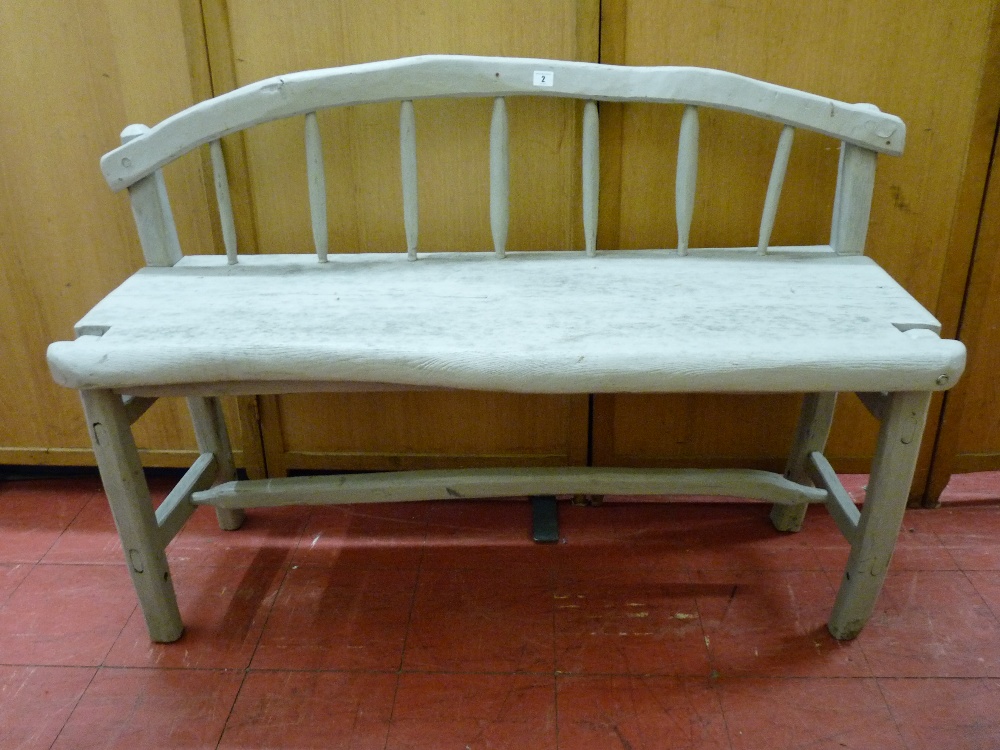 AN EARLY PAINTED RUSTIC SHEPHERD'S BENCH having a simply carved and curved top rail with spindles