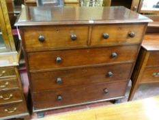 A VICTORIAN MAHOGANY CHEST of three long and two short drawers with turned wooden knobs, 112 cms
