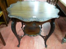 A GOOD EDWARDIAN MAHOGANY SIDE TABLE, the shaped 72.5 cms diameter top with leaf carved edging on