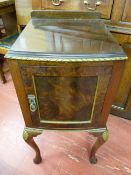 A SIMULATED BURR WALNUT NIGHT CABINET, gilt highlighted, the railback top with rope pattern