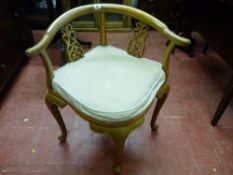 A CHINESE ROSEWOOD CORNER CHAIR with carved scroll splats and swept arms on shaped supports, 71.5