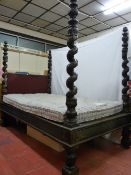AN ANTIQUE FOUR POSTER BED, early to mid 19th Century Spanish, with finial capped twist posts,