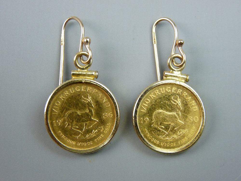 A PAIR OF 1/10th KRUGERRAND EARRINGS, dated 1980 and 1986, the earring mounts with screw fittings on