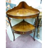 A REPRODUCTION MAHOGANY CORNER STAND with shaped gallery top and bow front shelf, the under tier