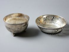 TWO SMALL SILVER BOWLS, Birmingham 1886 with beaded rim and reeded body on three ball feet and