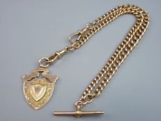 A NINE CARAT GOLD ALBERT with nine carat gold pendant fob marked 'H H T Winners, 1908-09, W