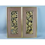 A PAIR OF OBLONG GILT WOOD ORIENTAL FRAMES, one depicting cranes, lilies and frogs etc and the other