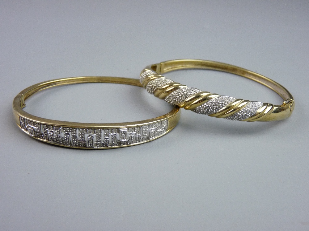 TWO MODERN NINE CARAT GOLD DIAMOND SET BANGLES, one with Greek Key style illusion setting of tiny