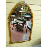 A REPRODUCTION WALNUT FRAMED WALL MIRROR, 91 cms high, 50 cms wide