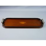 A SHERATON STYLE MAHOGANY DRINK'S TRAY of rectangular form with curved ends, closed gallery and