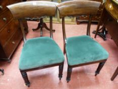 A PAIR OF REGENCY MAHOGANY SIDE CHAIRS, the wide concave top rail with carved apron decoration,