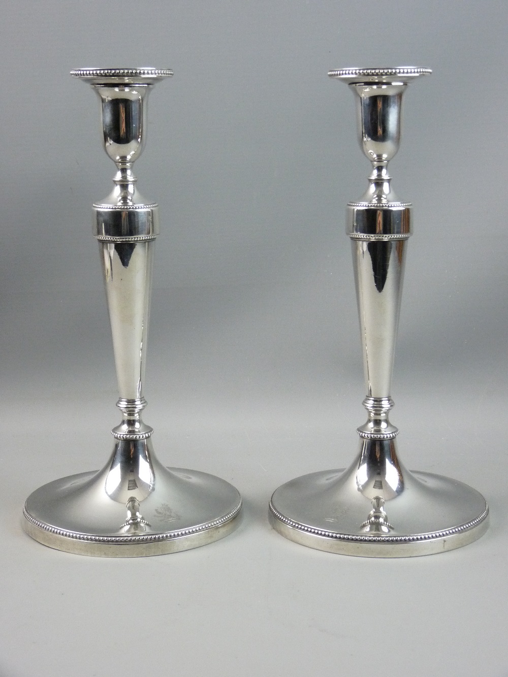 A PAIR OF GEORGE III SILVER CANDLESTICKS, the urn shaped candleholders with detachable sconces on