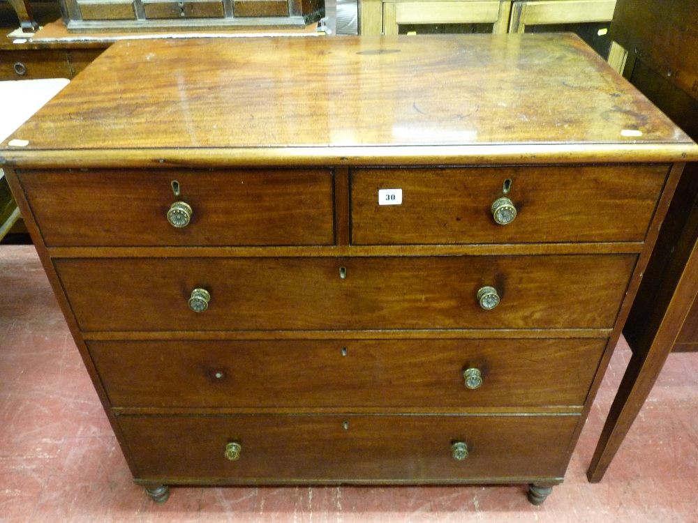 A LATE 19th CENTURY MAHOGANY CHEST of three long and two short drawers with circular patterned brass