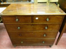 A LATE 19th CENTURY MAHOGANY CHEST of three long and two short drawers with circular patterned brass