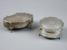 TWO SILVER TRINKET BOXES, a circular example with shaped engine turned lid on hoof feet,