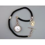 A NINE CARAT GOLD LADY'S FOB WATCH on a plaited hair Albert, the open faced watch having a white