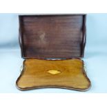 AN EDWARDIAN TWIN HANDLED TRAY & ONE OTHER, both mahogany, one with a closed gallery and twin