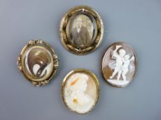 FOUR LARGE VICTORIAN BROOCHES to include a shell carved cameo depicting winged cherubs and one other