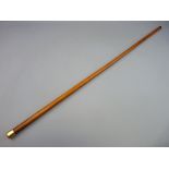 A MALACCA WALKING CANE with eighteen carat gold pommel top, 93.5 cms long