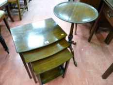 A NEST OF THREE BOW FRONT MAHOGANY COFFEE TABLES and a circular topped mahogany tilt top tripod