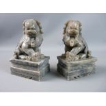 A PAIR OF CHINESE CARVED STONE TEMPLE LIONS, 20th Century, well carved, grey marble effect on