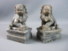 A PAIR OF CHINESE CARVED STONE TEMPLE LIONS, 20th Century, well carved, grey marble effect on