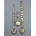 THREE NINE CARAT GOLD LADY'S WRISTWATCHES with expanding straps, one in half hunter style, 76 grms