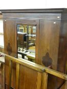 A CIRCA 1900 INLAID MAHOGANY WARDROBE with central mirrored door and base drawer, 203 cms high,