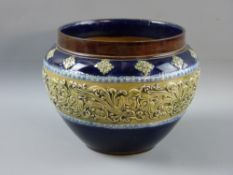 A DOULTON LAMBETH STONEWARE PLANTER having a raised central band of stylized floral on a cobalt