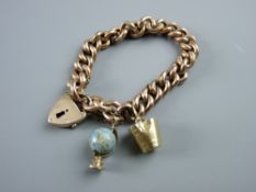 A NINE CARAT GOLD HOLLOW LINK BRACELET & PADLOCK with safety chain and two charms (a bucket and a