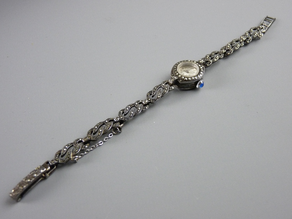 A LADY'S ROTARY SILVER & MARCASITE WRISTWATCH with moonstone set winder