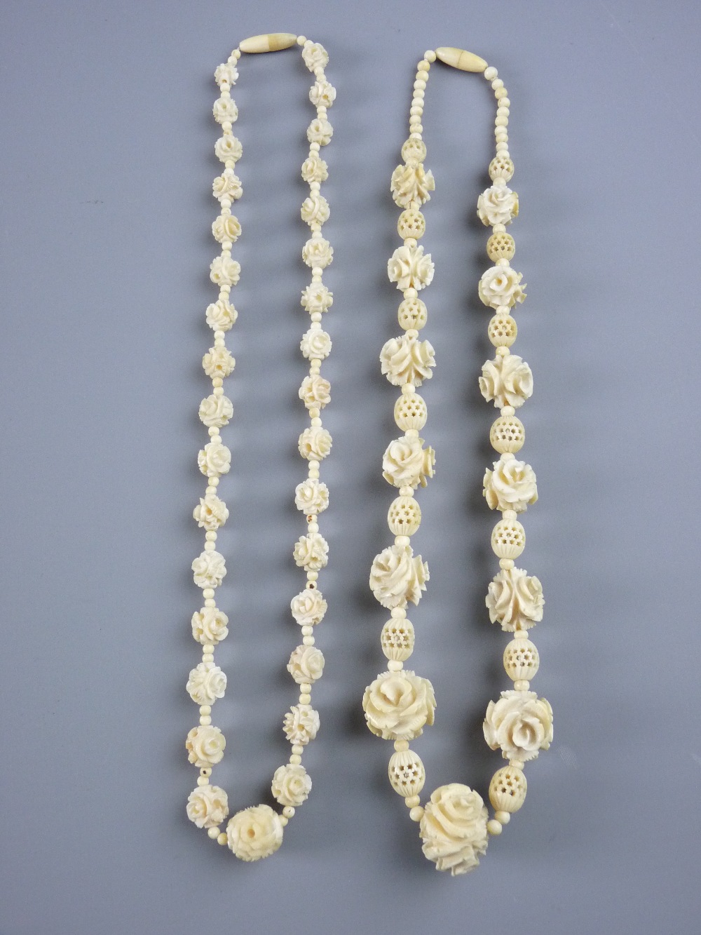 TWO CARVED IVORY BALL & FLORAL NECKLACES