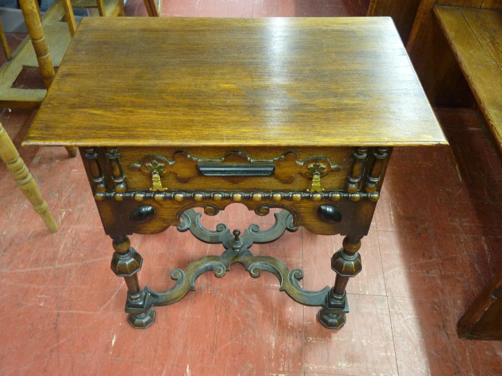 A REPRODUCTION OAK LOWBOY, 17th Century Dutch style having a rectangular top over a single frieze