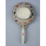 A CHINESE SILVER & JADE CIRCULAR HAND MIRROR with celadon jade handle having a bat terminal and