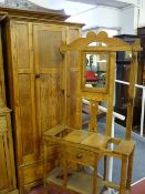 A STRIPPED OAK MIRRORED HALLSTAND, early 20th Century with central drawer on turned supports, 178