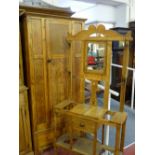 A STRIPPED OAK MIRRORED HALLSTAND, early 20th Century with central drawer on turned supports, 178