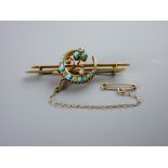 A DIAMOND & TURQUOISE SET CRESCENT BAR BROOCH, unmarked but probably eighteen carat gold, with