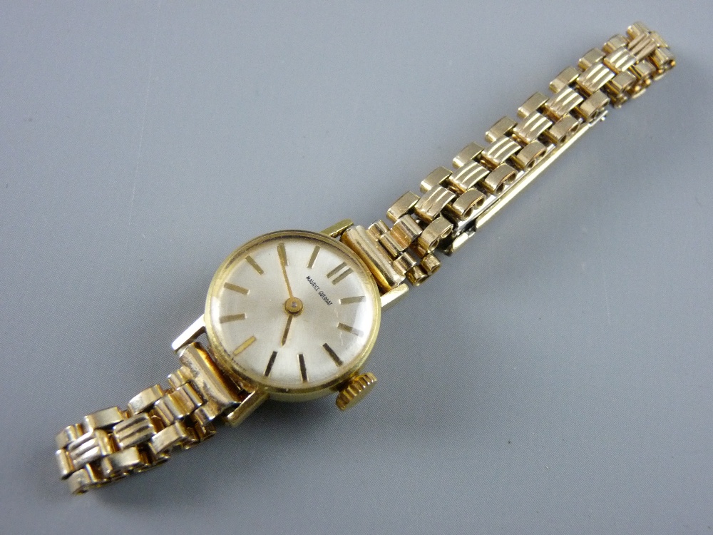 AN EIGHTEEN CARAT GOLD CASED LADY'S WRISTWATCH, the dial with baton indicators marked 'Maurice