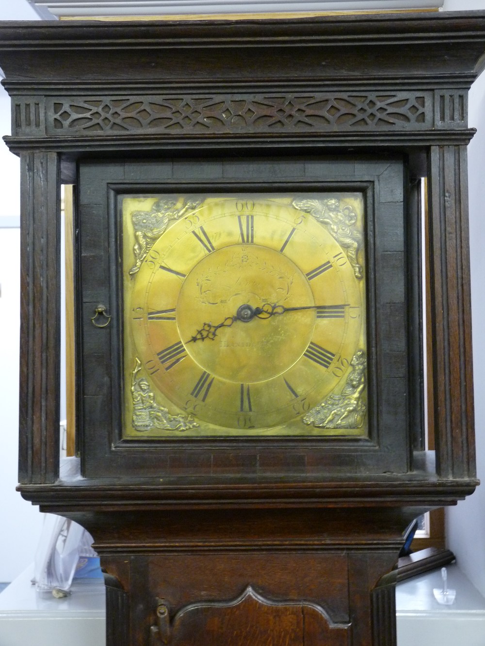A CIRCA 1820 OAK CASED BRASS DIAL LONGCASE CLOCK by Lewis, Llanidloes, the 11.25 ins dial set with