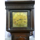 A CIRCA 1820 OAK CASED BRASS DIAL LONGCASE CLOCK by Lewis, Llanidloes, the 11.25 ins dial set with