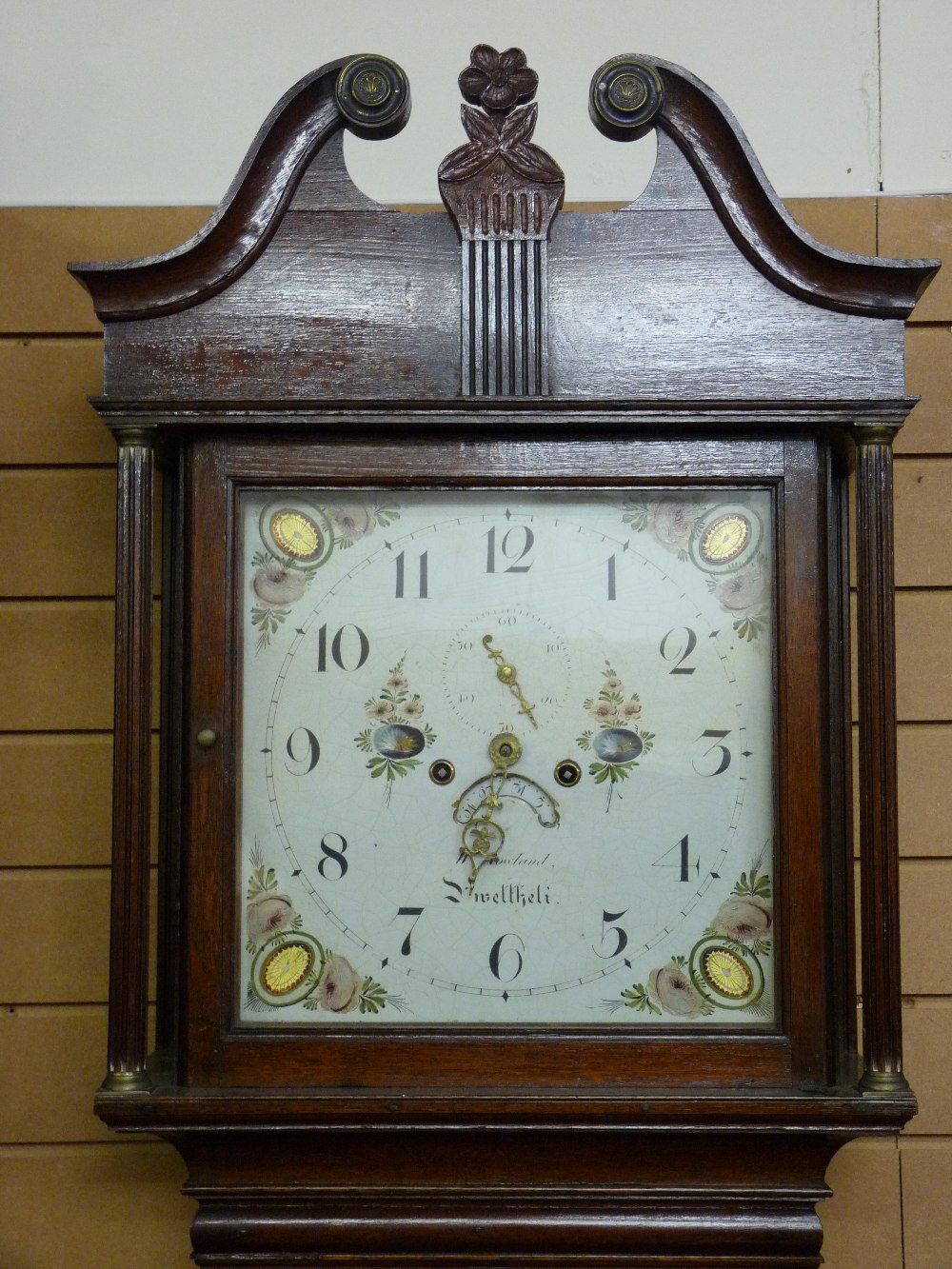 A CIRCA 1820 OAK LONGCASE CLOCK by W Rossland, Pwllheli, the 14 ins square painted dial with