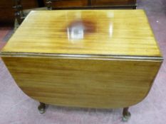 A CIRCA 1910 MAHOGANY TWIN FLAP DINING TABLE on cabriole supports, 79 cms high (now raised on mid