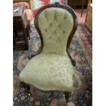 A VICTORIAN WALNUT SPOONBACK CHAIR, the top rail with carved cartouche and leaf decoration, button